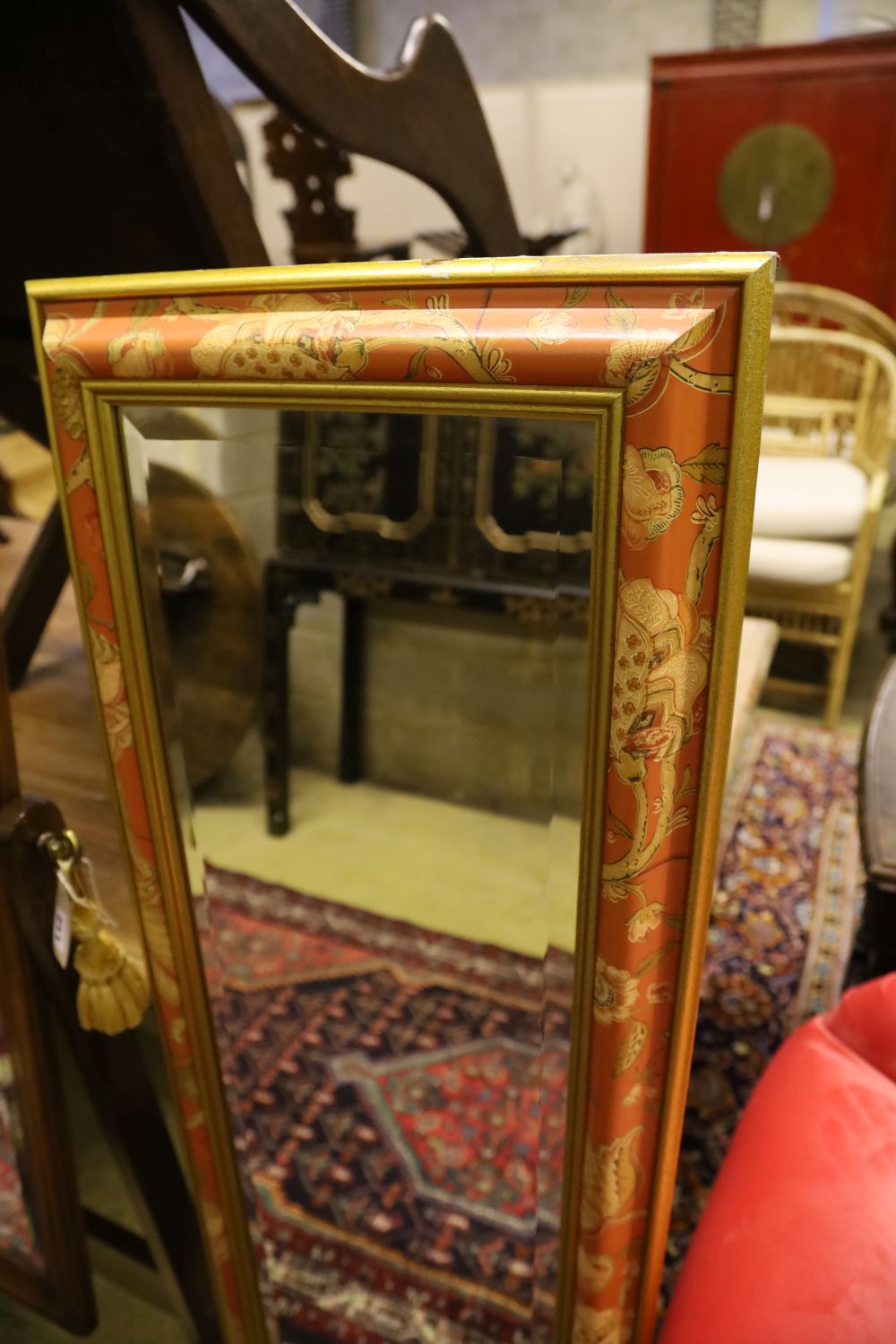 A modern mahogany cheval mirror with shaped top, 160cm high and a rectangular wall mirror with decorative frame